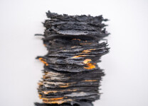 This contemporary glass wall sculpture resembles rock. Image 6