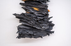 This contemporary glass wall sculpture resembles rock. Image 5