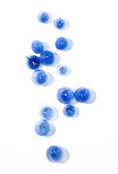 This contemporary lapis colored glass wall sculpture was created by Cheryl Wilson Smith.