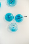 This contemporary wall sculpture features bubbles of blue glass. Image 5