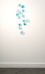 This contemporary wall sculpture features bubbles of blue glass. Image 9