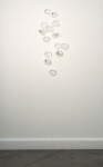 This contemporary wall sculpture features bubbles of clear glass. Image 7