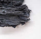 This contemporary glass wall sculpture resembles rock. Image 9