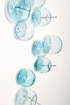 This contemporary wall sculpture features bubbles of blue glass. Image 5