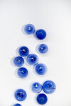 This contemporary lapis-colored glass wall sculpture was created by a Canadian artist. Image 6