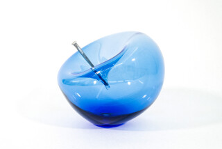 The contemporary cerulean-blue glass tabletop sculpture is by Cheryl Wilson Smith.