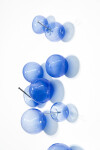 This contemporary wall sculpture features bubbles of lapis blue glass. Image 3