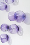 This contemporary, purple-colored, glass wall sculpture was created by Cheryl Wilson Smith. Image 8