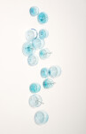 This contemporary wall sculpture features bubbles of blue glass. Image 3