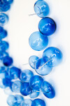 This contemporary glass wall sculpture features cerulean colored bubbles. Image 4