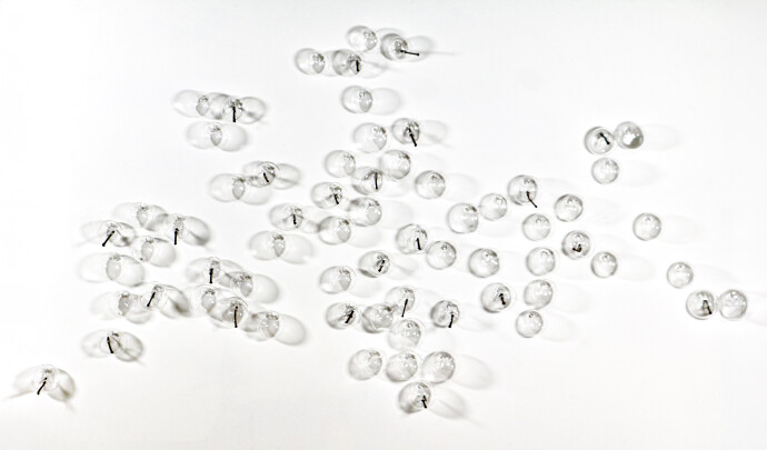 This contemporary clear glass wall sculpture was created by Cheryl Wilson Smith.