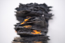 This contemporary glass wall sculpture resembles rock. Image 8