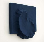 Sapphire blue felt takes the shape of a biomorphic form in this contemplative wall sculpture by fabric artist Chung-Im Kim. Image 2