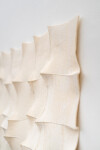 This contemporary white sculptural wall hanging was handmade. Image 9