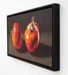 Two red-orange pomegranates, one cut cleanly in half are set on a dark ground in this realistically rendered and intimate oil painting on ca… Image 4