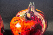 Two red-orange pomegranates, one cut cleanly in half are set on a dark ground in this realistically rendered and intimate oil painting on ca… Image 6