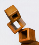 This contemporary metal floor sculpture is geometric in form. Image 6