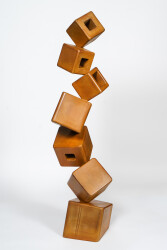 This contemporary metal floor sculpture is geometric in form.