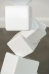 This contemporary indoor sculpture’s geometric steel form is coated in bright white. Image 11