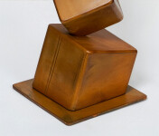 This contemporary metal floor sculpture is geometric in form. Image 3