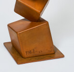 This contemporary metal floor sculpture is geometric in form. Image 2