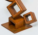 This contemporary metal floor sculpture is geometric in form. Image 5