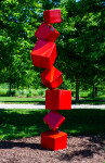 This outdoor contemporary geometric metal sculpture is made of red cubes. Image 2