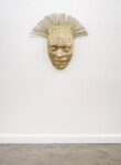 This contemporary sculpture is a mask forged from air craft cable and then carefully gilded with gold leaf. Image 2