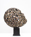 This contemporary table top sculpture is a mask forged from metal. Image 4