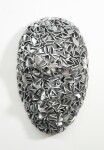 Forged from metal, this contemporary wall sculpture in a mask form is by Dale Dunning. Image 4