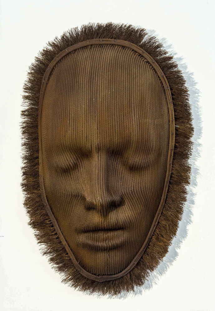 A mask of steel aircraft cable is framed by a halo of unwound ends.