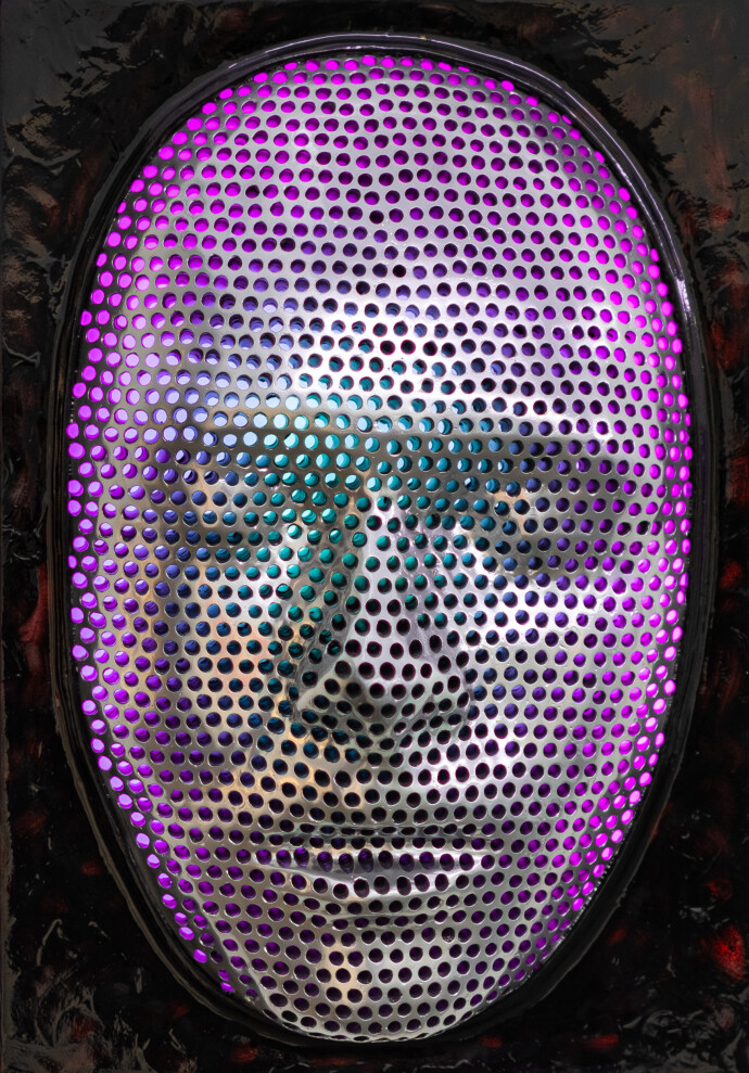 This contemporary figurative wall sculpture is a mask forged from metal lit with LED light.