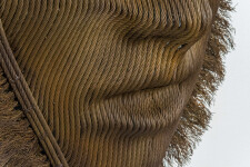 A mask of steel aircraft cable is framed by a halo of unwound ends. Image 8