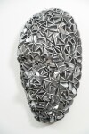 Forged from metal, this contemporary wall sculpture in a mask form is by Dale Dunning. Image 3