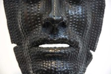 This powerful and haunting life-sized mask by Dale Dunning is cast in bronze and sits on its own pedestal. Image 4