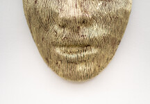 This contemporary sculpture is a mask forged from air craft cable and then carefully gilded with gold leaf. Image 5