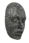 This contemporary metal wall sculpture is a mask. Image 5