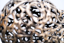 This contemporary table top sculpture is a mask forged from metal. Image 11