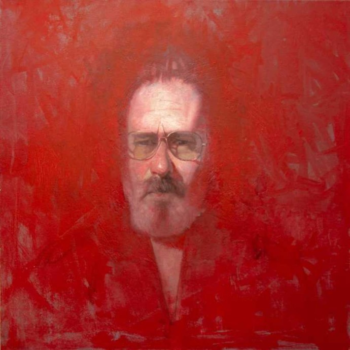 In this haunting self-portrait by Canadian realist Dan Hughes, the artist’s face seems to emerge from a rich red background.