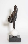 A bronze hand, modelled after the artist’s own, balances on its index finger atop a sphere in this imaginative pop art sculpture by Dave She… Image 5