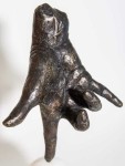 A bronze hand, modelled after the artist’s own, balances on its index finger atop a sphere in this imaginative pop art sculpture by Dave She… Image 2