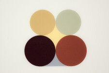 Curated circles in pale green, gold, black and toned maroon are precisely and contemplatively arranged on a light dove grey ground. Image 3