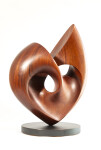 The graceful curves of this contemporary solid mahogany sculpture by David Chamberlain appear to emulate the image of a heart. Image 11