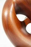 The graceful curves of this contemporary solid mahogany sculpture by David Chamberlain appear to emulate the image of a heart. Image 7