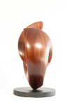 The graceful curves of this contemporary solid mahogany sculpture by David Chamberlain appear to emulate the image of a heart. Image 10