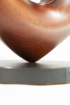 The graceful curves of this contemporary solid mahogany sculpture by David Chamberlain appear to emulate the image of a heart. Image 6