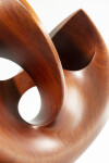 The graceful curves of this contemporary solid mahogany sculpture by David Chamberlain appear to emulate the image of a heart. Image 5