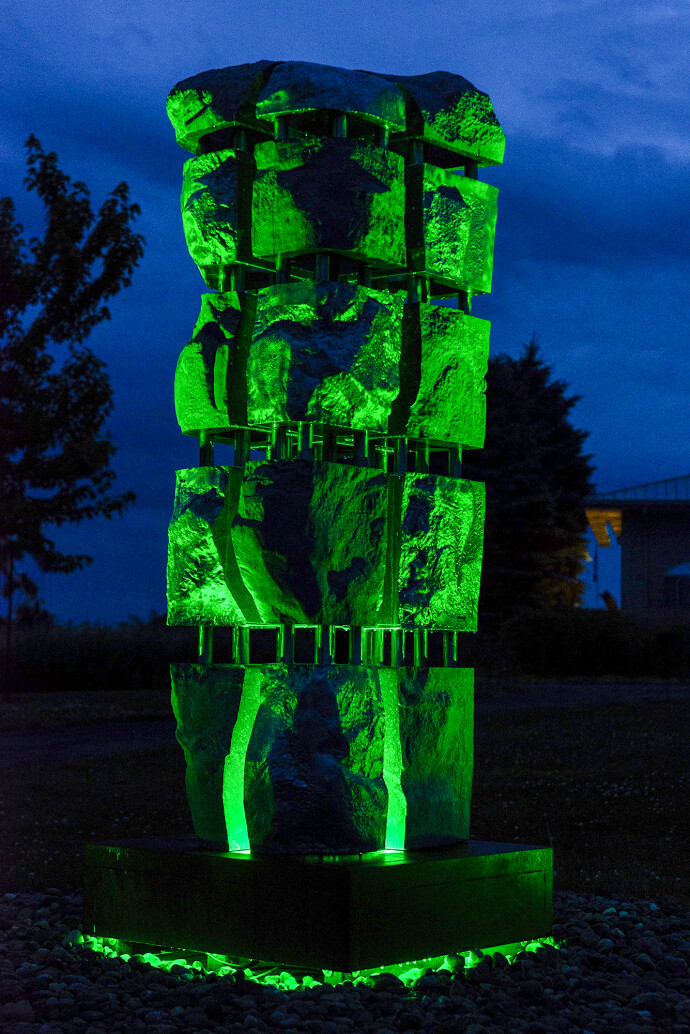 This contemporary abstract monumental stone sculpture is by David Perrett.