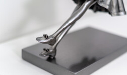 This contemporary figurative indoor sculpture of a female is hand forged from metal. Image 12