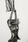 This figurative steel kinetic indoor sculpture challenges cultural norms about women. Image 3